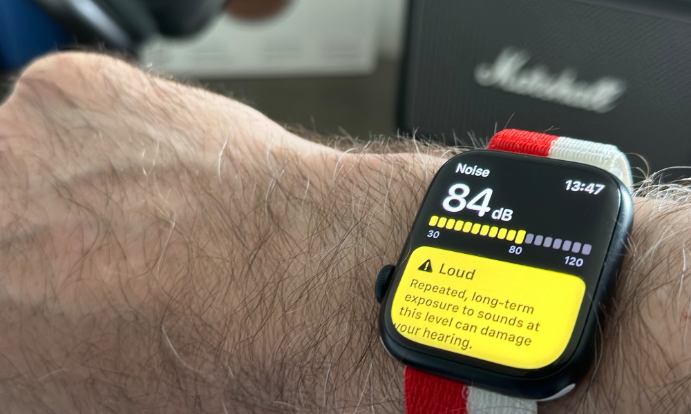 Person wearing Apple Watch with Noise app reporting loud noise