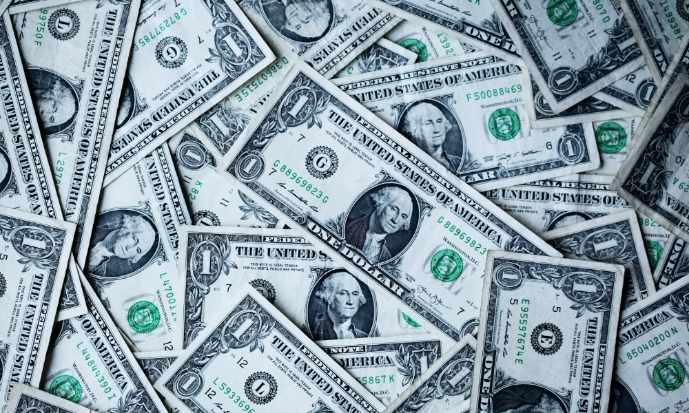 money savings collage of dollar bills