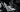 person using MacBook greyscale