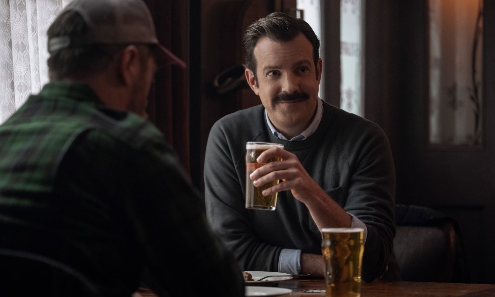 Ted Lasso enjoying a pint with Coach Beard