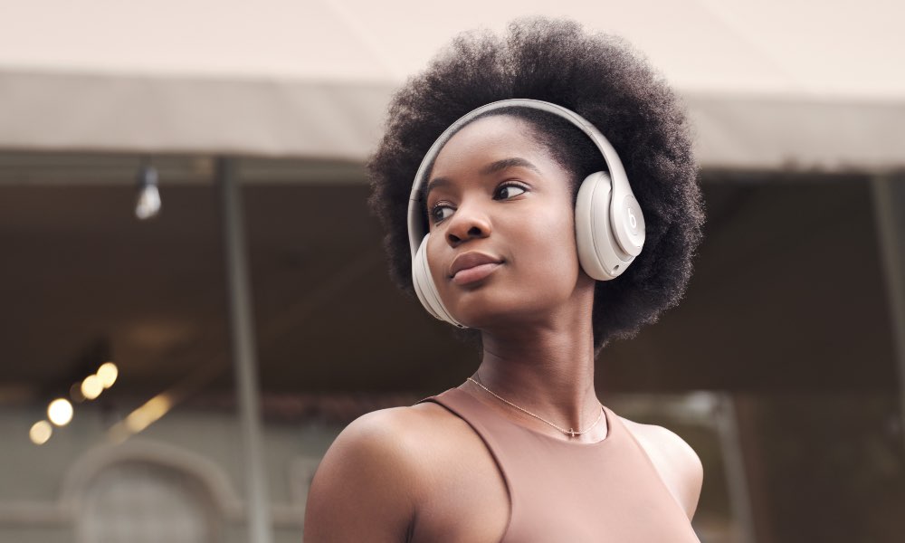 Woman wearing Beats Studio Pro.