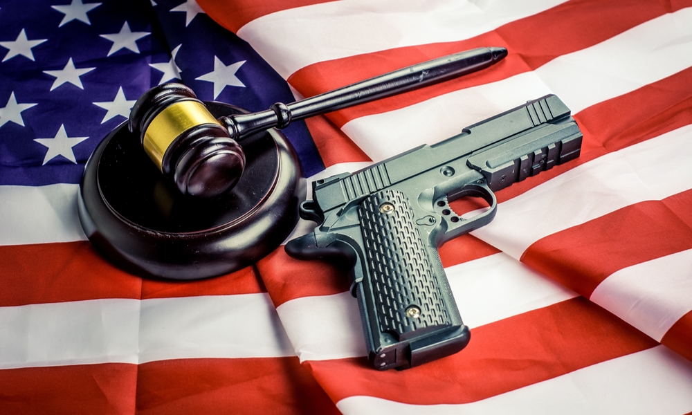 gun and gavel against US flag