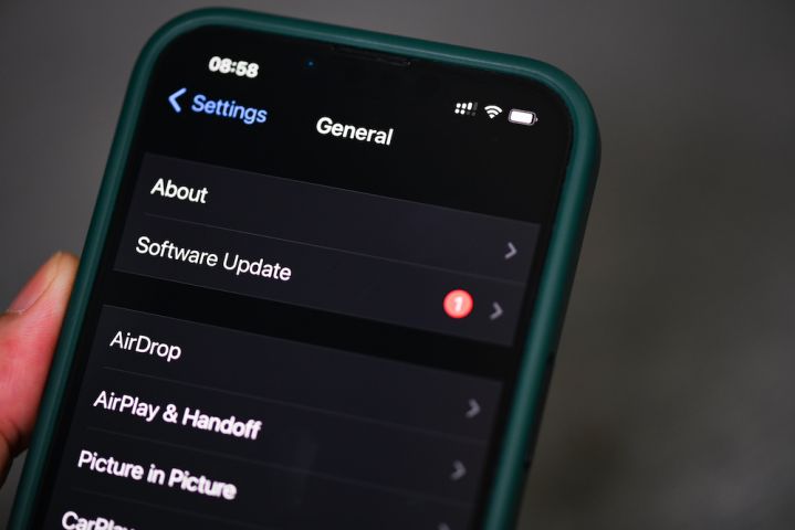 iPhone 13 Pro with notification software update iOS 15.5 on the screen close up, new operating system 2022 on iPhone apple devices for download updates : Bangkok, Thailand May 29 202