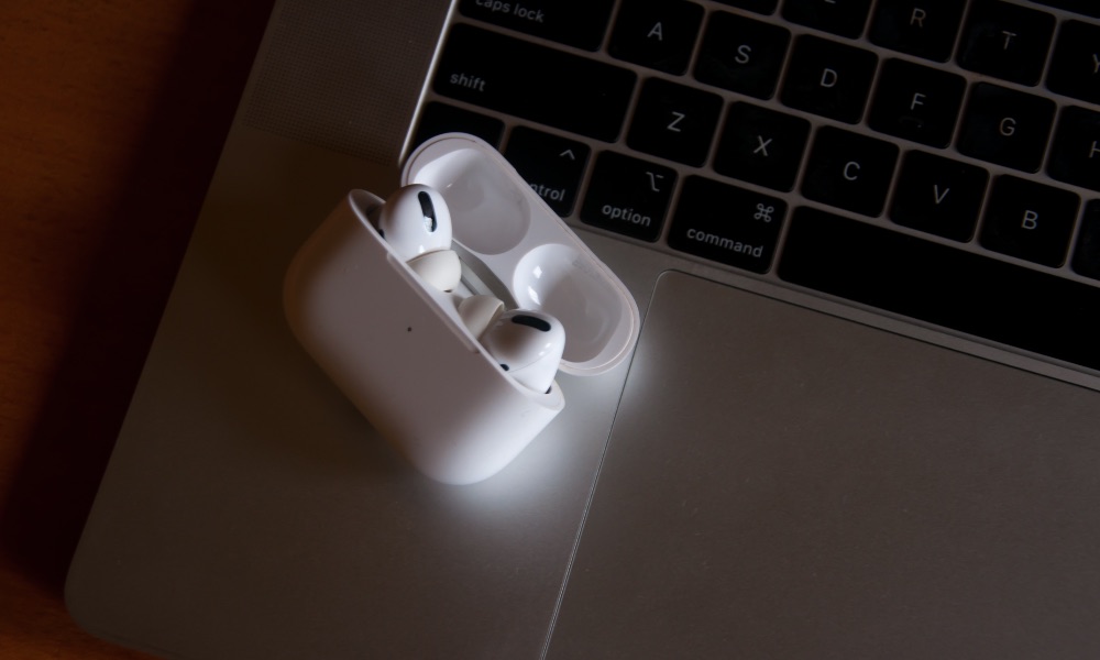 AirPods Pro in case on MacBook keyboard