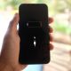 An iPhone screen showing a red battery icon at 1% with the 'Low Battery' alert.