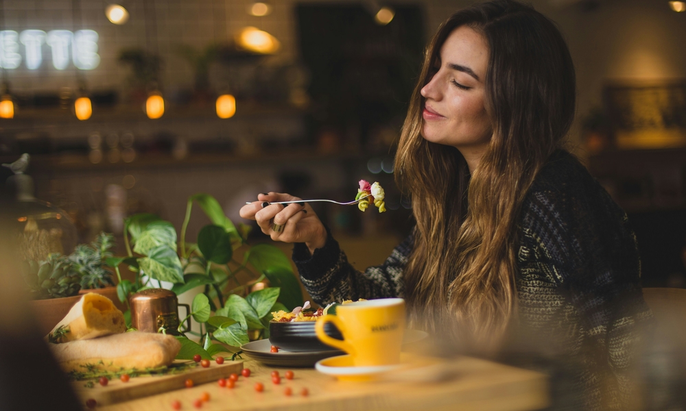 woman eating and enjoying her meal