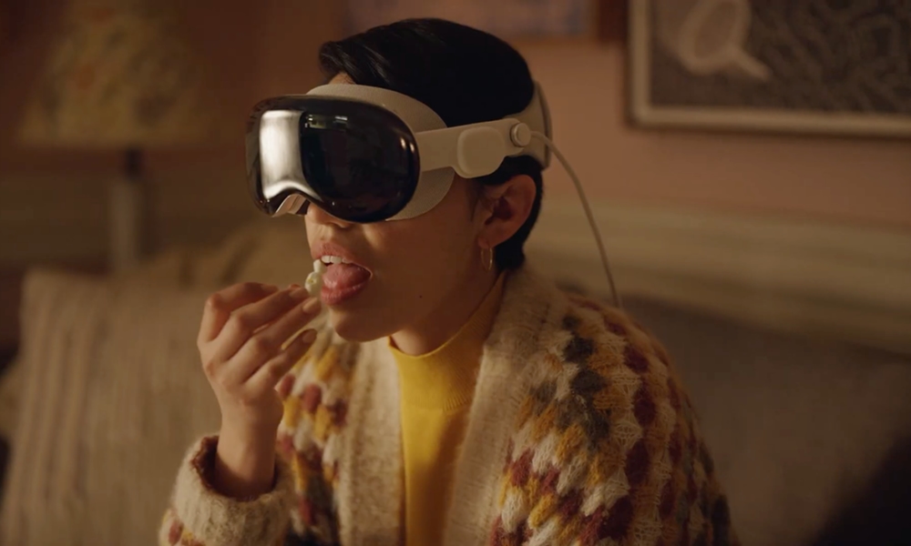 WWDC 2023 woman wearing vision pro eating popcorn