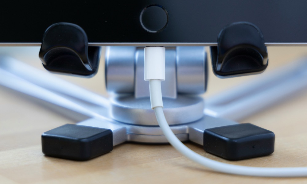 iPad on stand with charging cable plugged in iPad on stand with charging cable plugged in