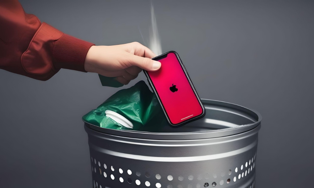person dropping iPhone into garbage can