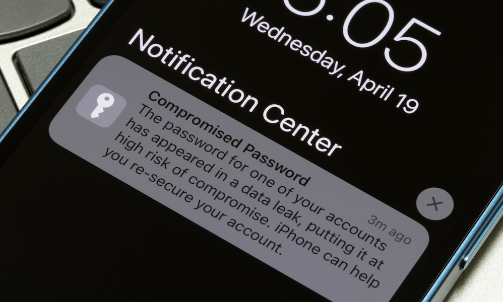 Portland, OR, USA Apr 19, 2023: Closeup of the Compromised Password notification seen on an iPhone's lock screen. Data breach concept.