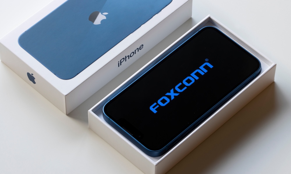 Portland, OR, USA Oct 19, 2021: The Foxconn logo is seen on a new iPhone 13 Mini. Foxconn Technology Group is a Taiwanese multinational electronics contract manufacturer and a key Apple supplier.