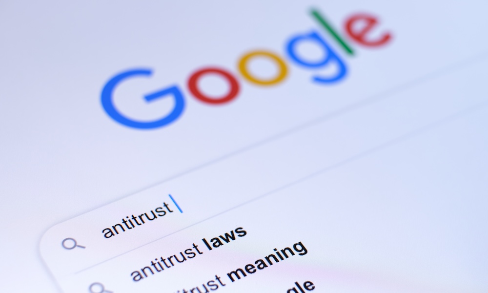 Antitrust word typed in a search bar with visible google logo on the blurred background. Selective focus. Concept.