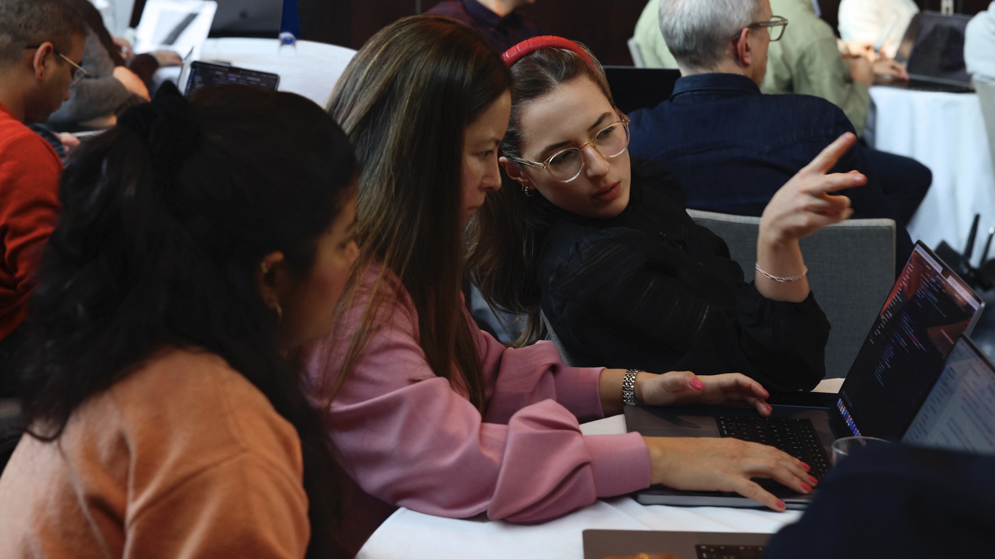 WWDC25 students using MacBook