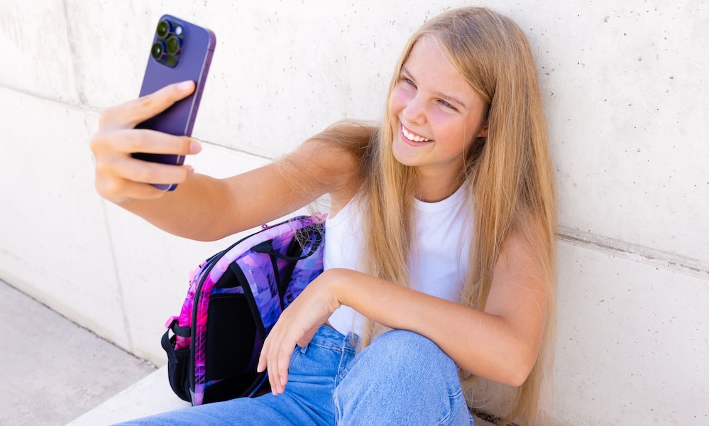 Teenage girl making video call on mobile phone Teenage girl making video call on mobile phone