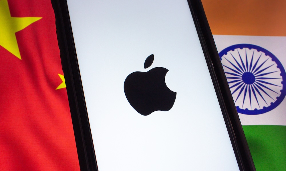 Mexico City, MEXICO Mar 30 2025 : Close up of a smartphone displaying the Apple logo, placed against the national flags of China and India, symbolizing tech trade relations.