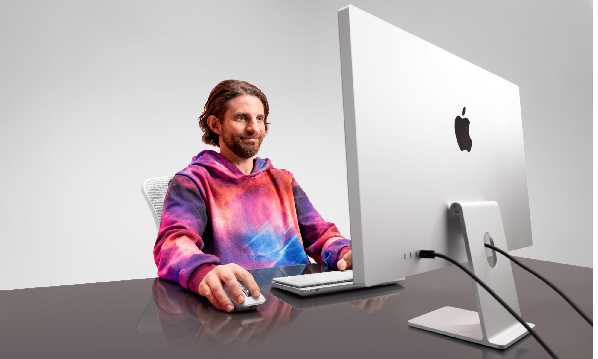 Person using Logitech MX Master 4 at workstation