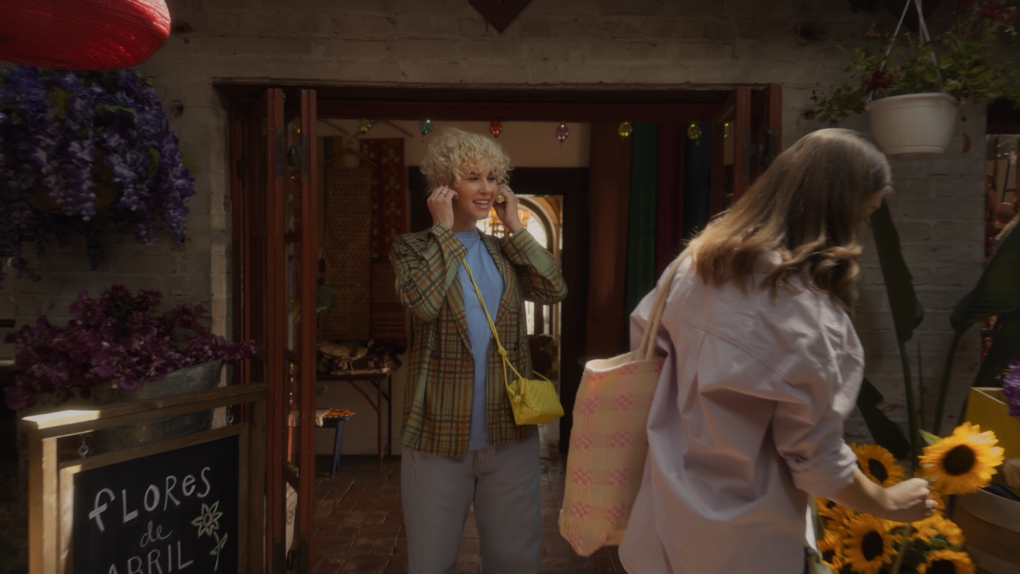 Woman engaging Live Translation on AirPods 