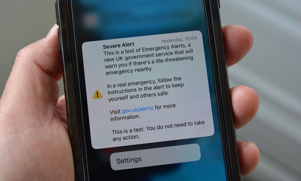 Cellphone in hand with Severe Alert notification Cellphone in hand with Severe Alert notification