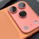 Detailed close-up of the triple-lens camera array on the back of an iPhone 17 Pro.
