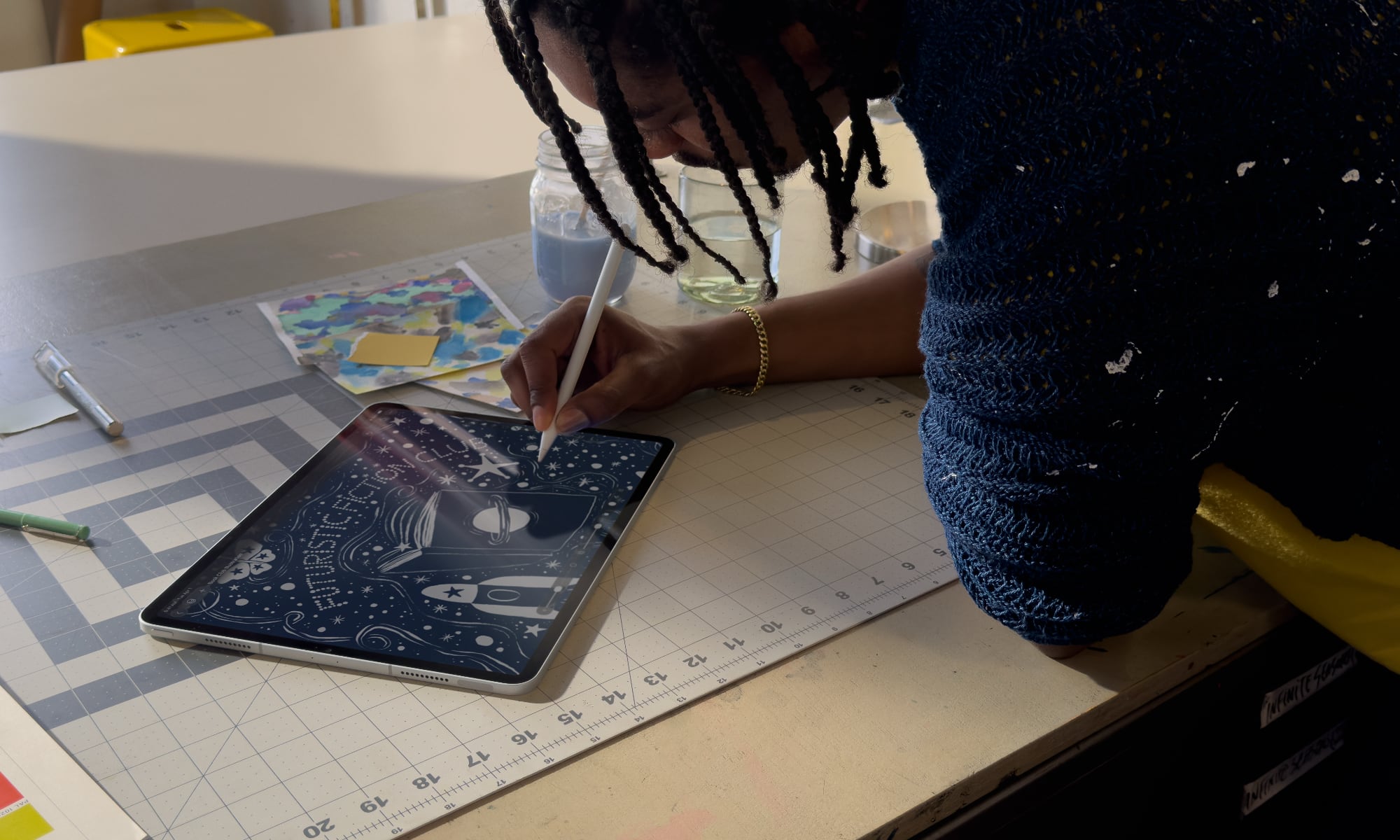 A lifestyle photo of a digital artist using Pixelmator Pro on an iPad Pro. The artist is using an Apple Pencil to perform precise photo retouching on a high-resolution image, showcasing the new touch-optimized interface and the 'Warp Tool' feature mentioned in the Apple Creator Studio announcement.