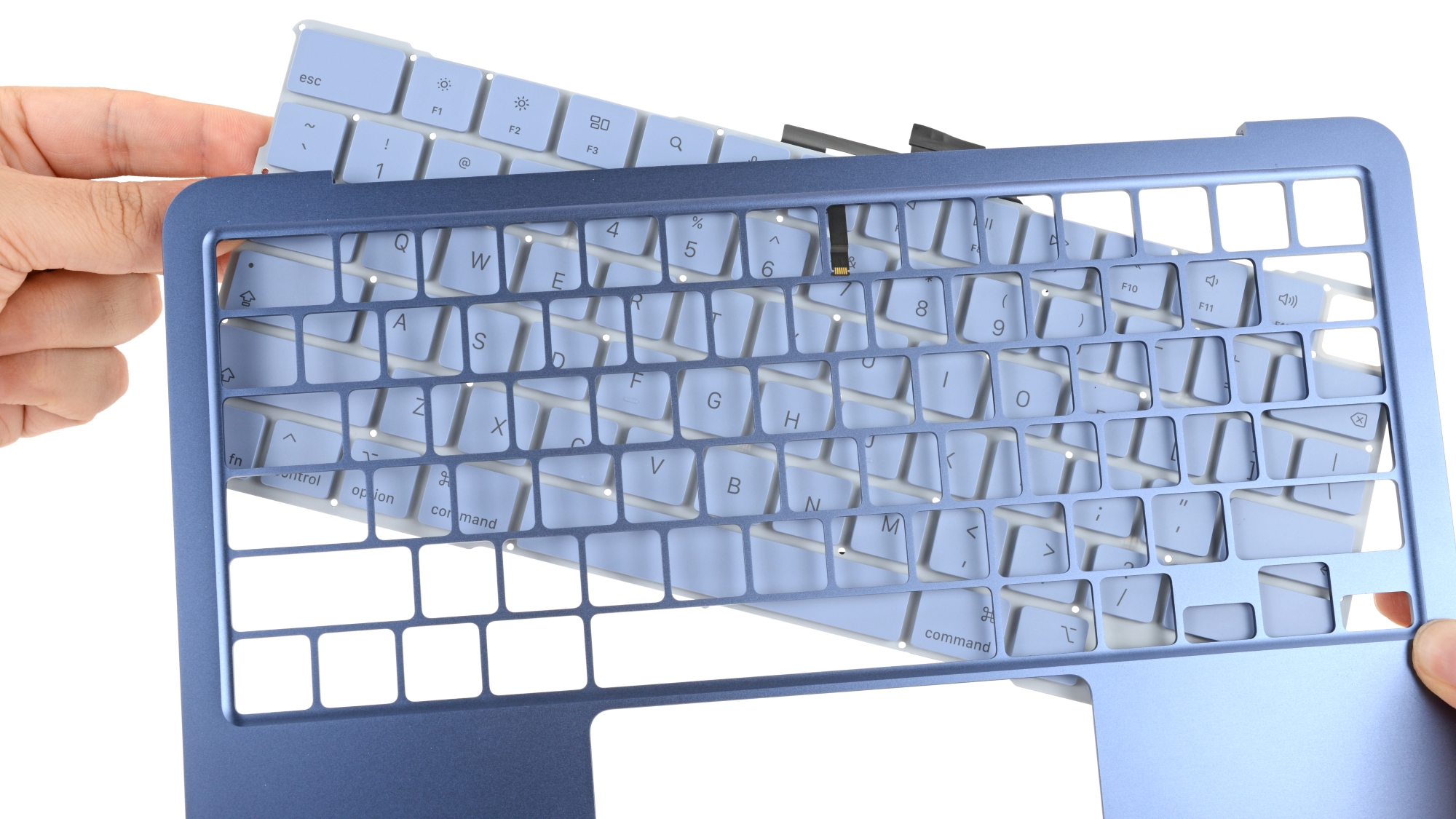 Close-up of the MacBook Neo's keyboard assembly.