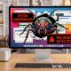 A Mac Studio and Studio Display on a modern desk showing a large bug and virus infection warnings on the screen.