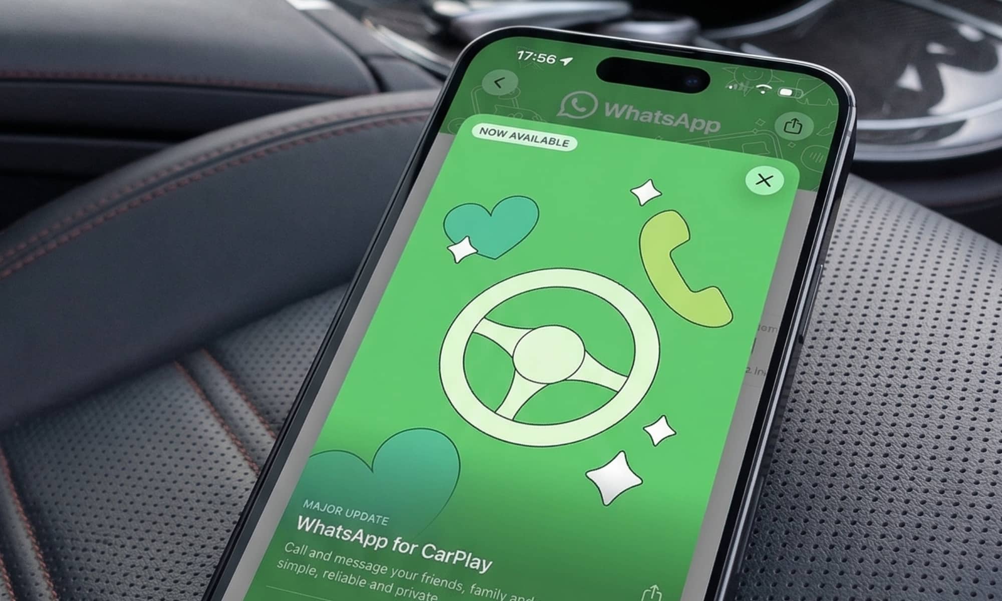 A wide landscape 16:9 view of a modern car interior with dark leather seating. An iPhone rests on the driver’s seat, displaying the green 'WhatsApp for CarPlay' App Store update screen which features a stylized steering wheel graphic and the words 'Major Update.'