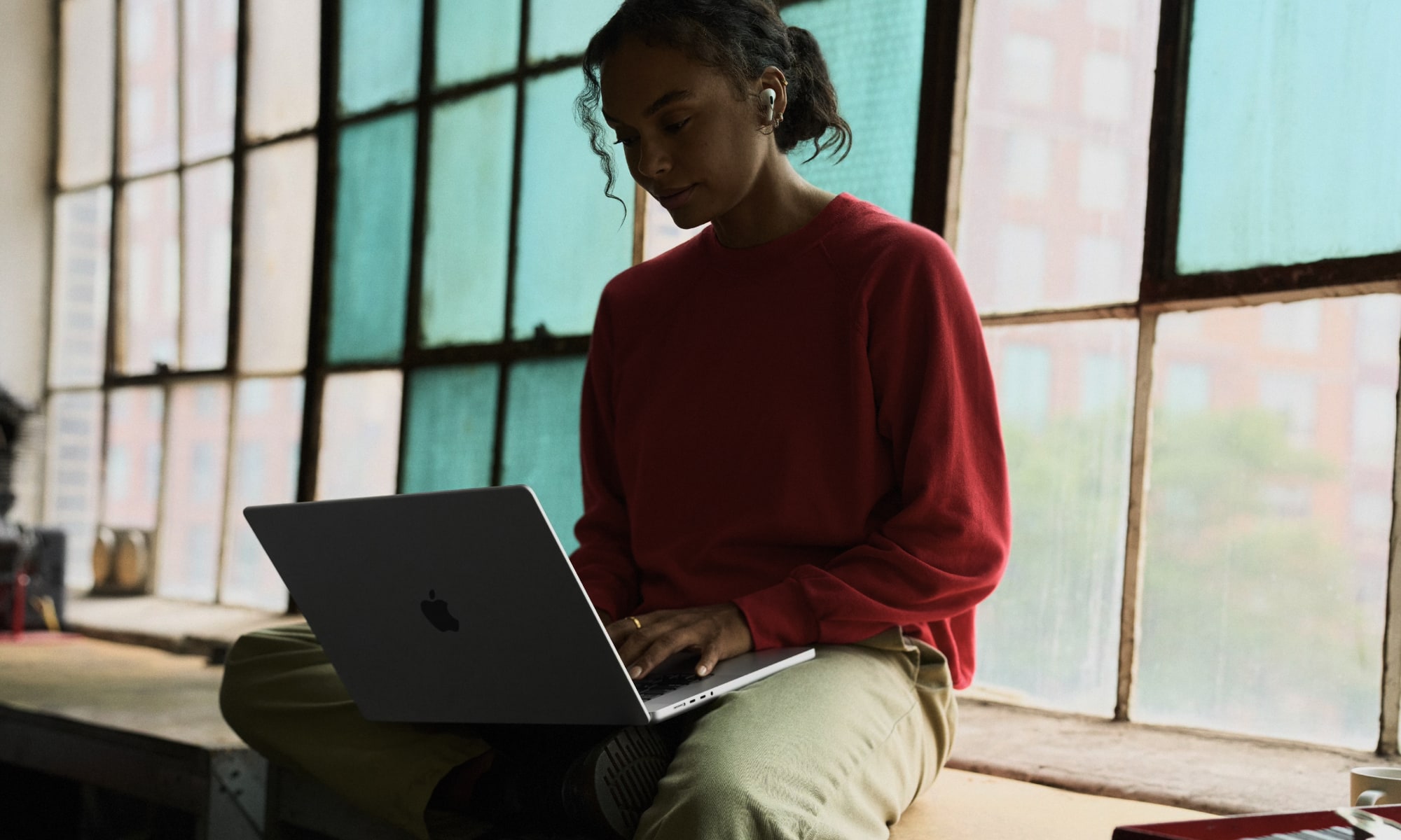 WWDC26 10 lifestyle woman student macbook airpods