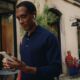 WWDC26 42 lifestyle man walking coffee shop iPhone AirPods