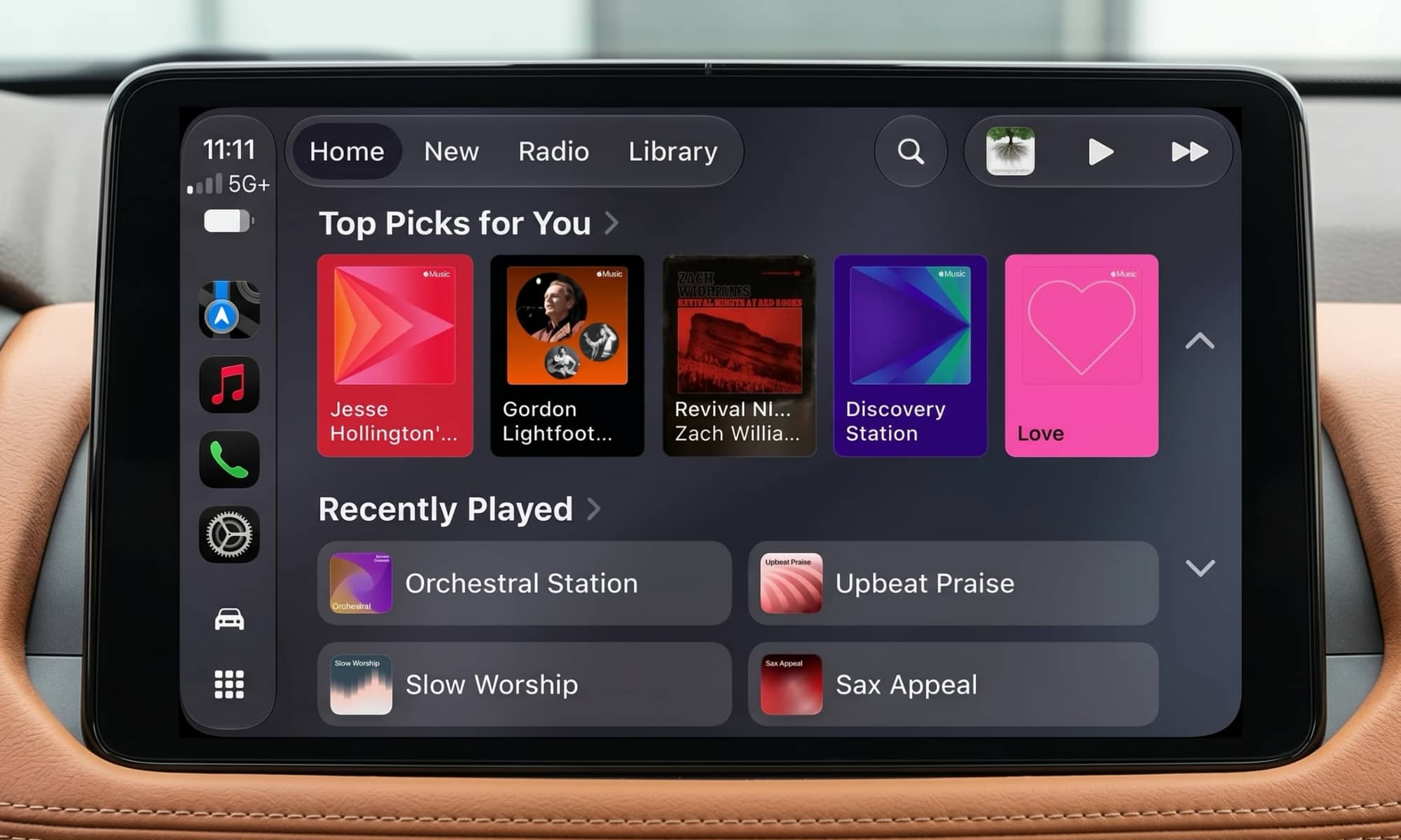 Vehicle infotainment display showing CarPlay Apple Music screen in iOS 27, highlighting new mini-player in top-right corner.