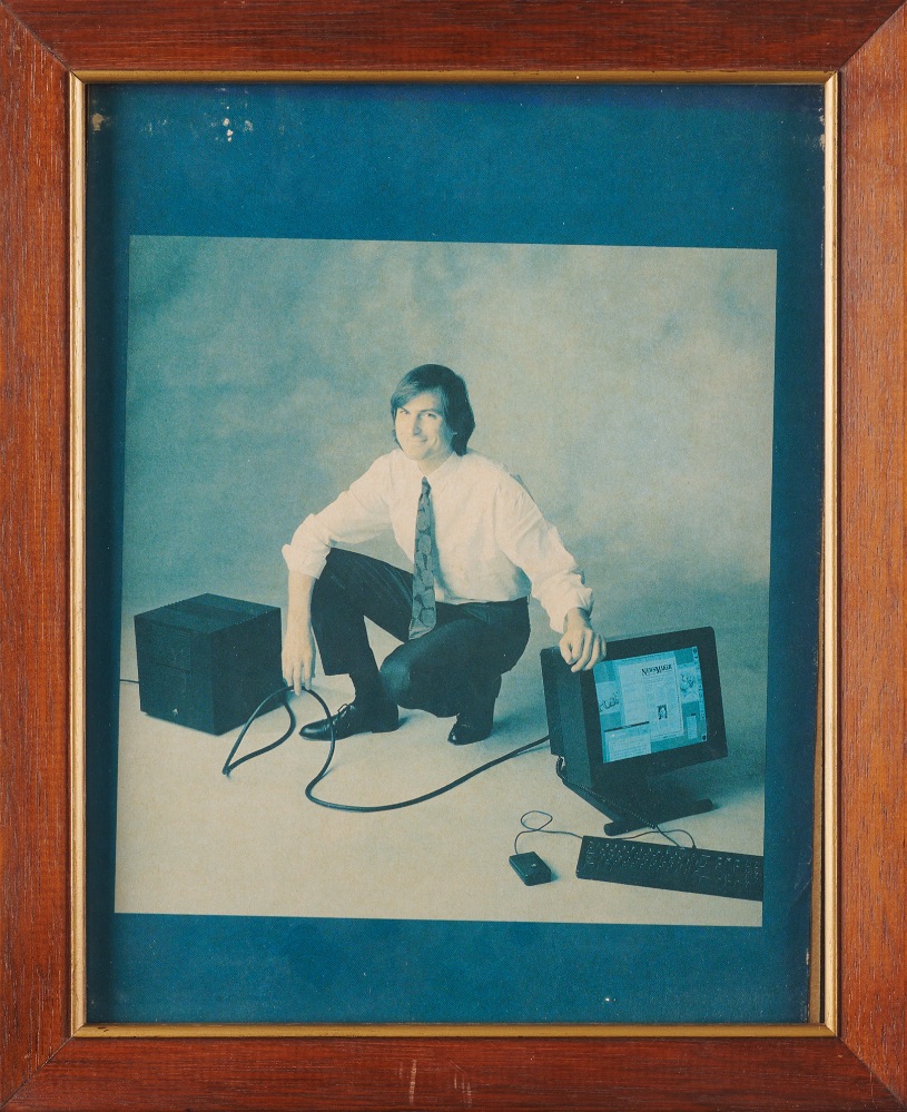 Framed October 1989 promotional magazine page of Steve Jobs posing with a NeXT computer.