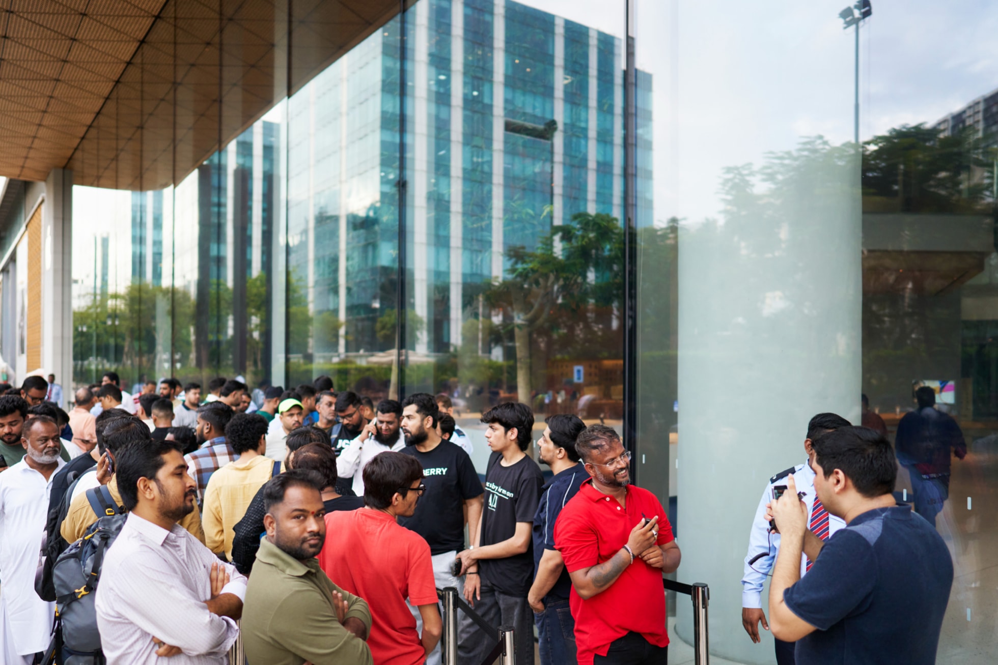 Customers wait in line outside Apple BKC in Mumbai.