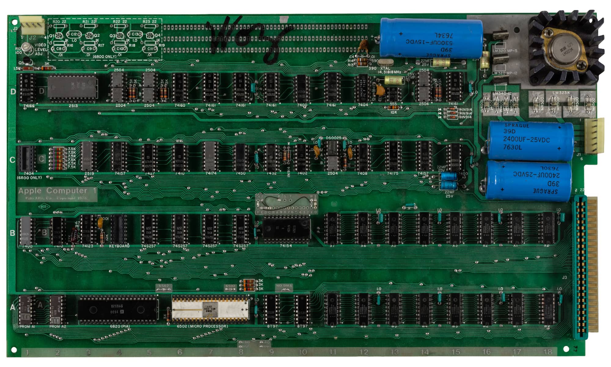 Close-up of the Hatfield Apple-1 computer motherboard featuring an authentic autograph by Apple co-founder Steve Wozniak.